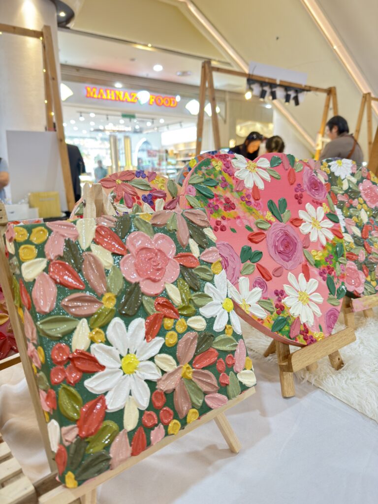 People enjoying creative mobile art workshops in Singapore together