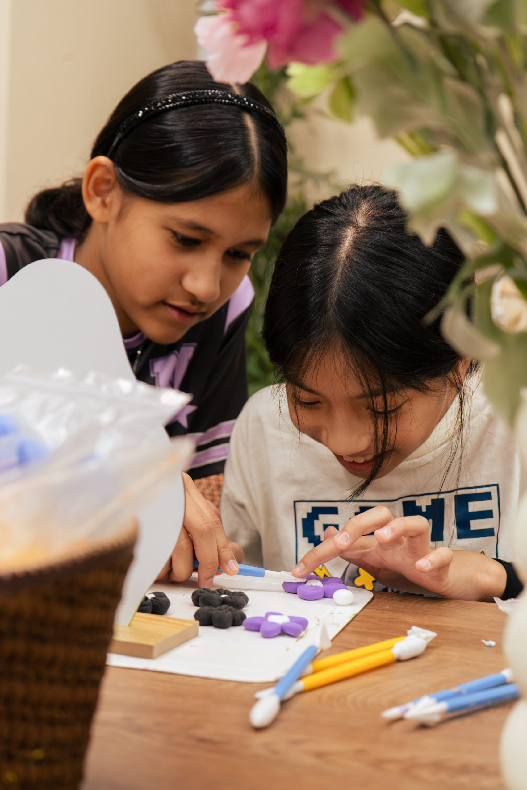 Young makers shaping clay by hand at ArtRoots Studio