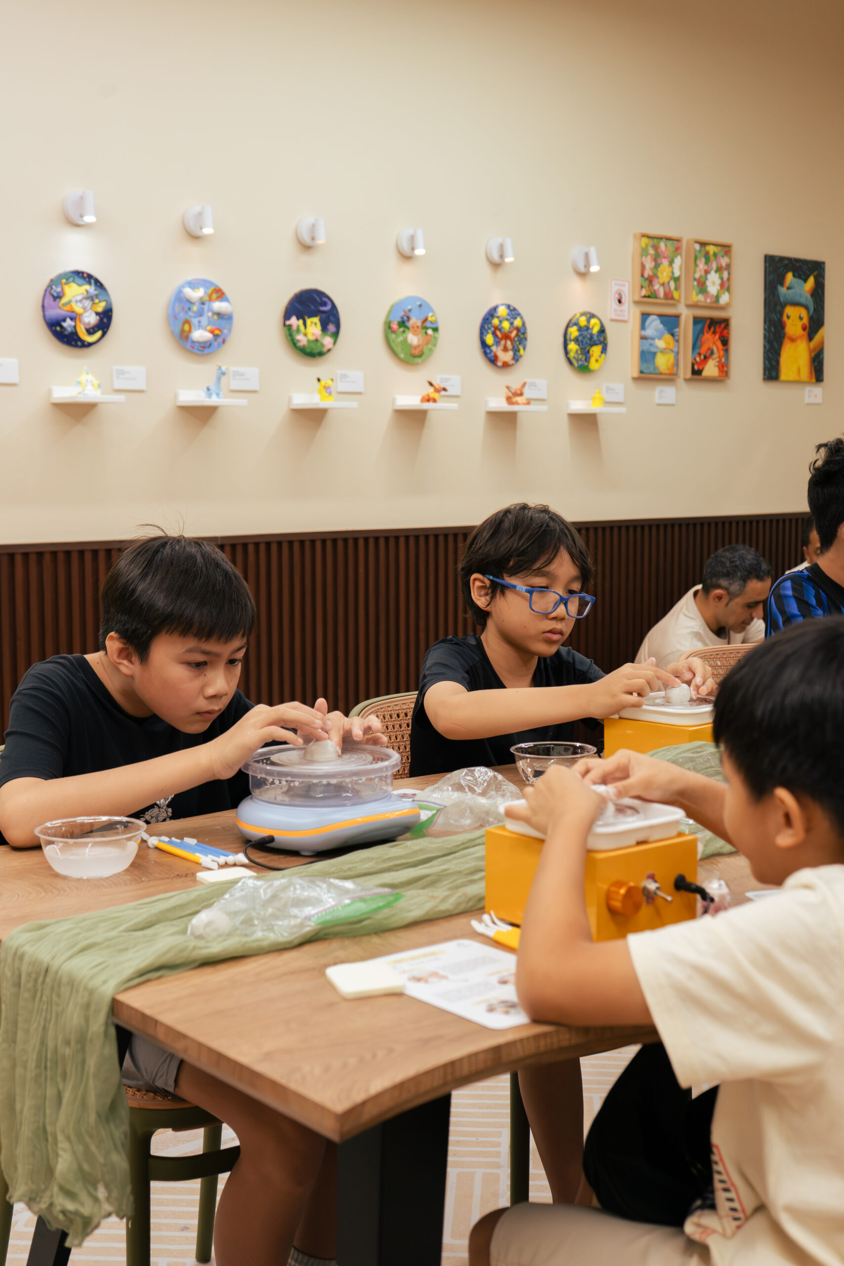 Colourful finished pottery pieces at an ArtRoots pottery painting workshop